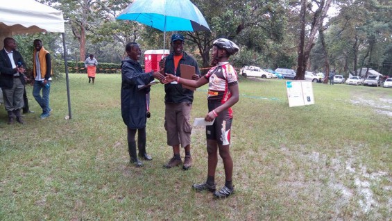 Cyclist receiving an award