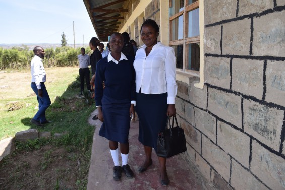Form 1 student, Emily, arriving in the company of her mother, Roseland, eduKenya Skills Training tutor.