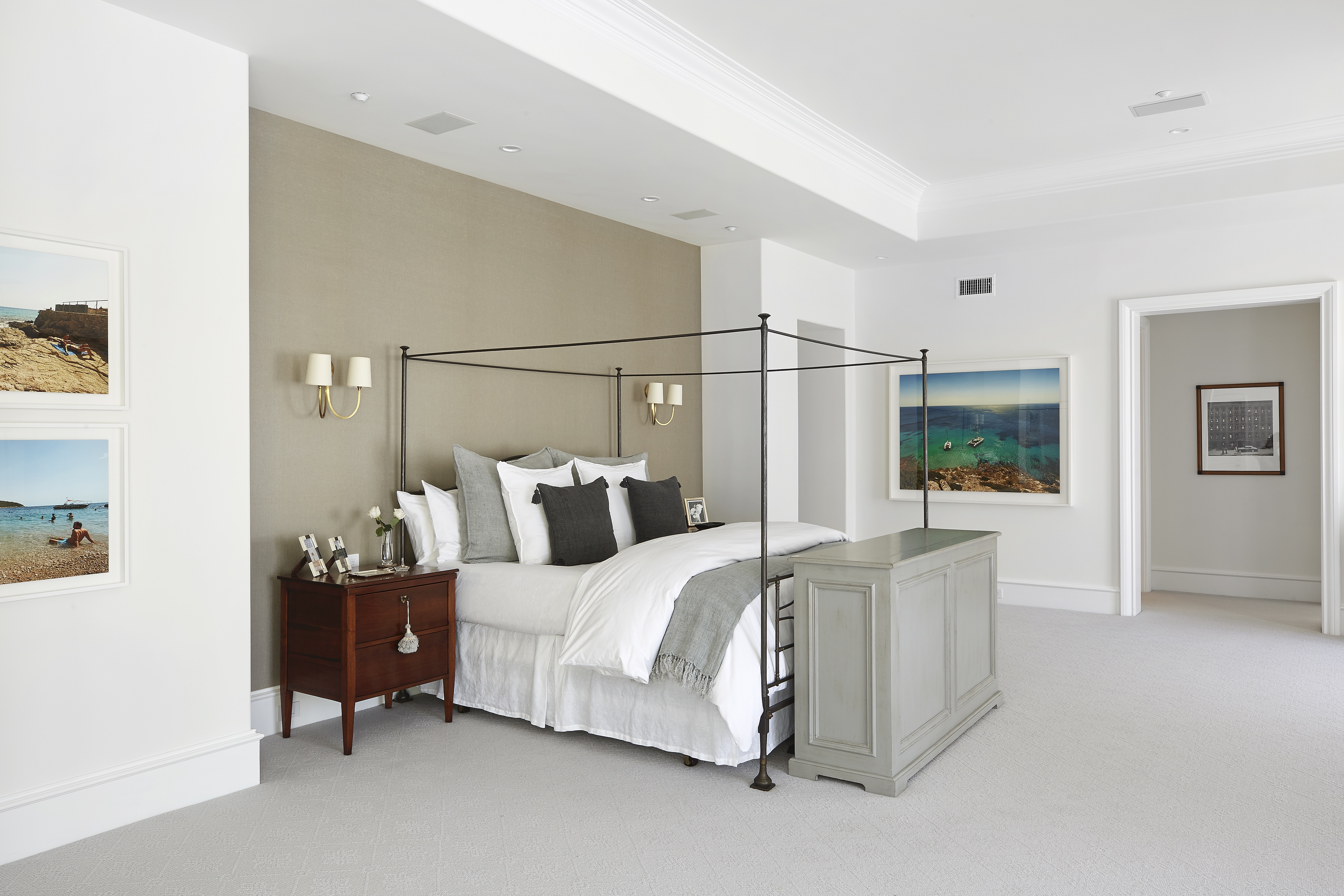 Neutral walls, carpet and bedding makes this master suite a sleep sanctuary