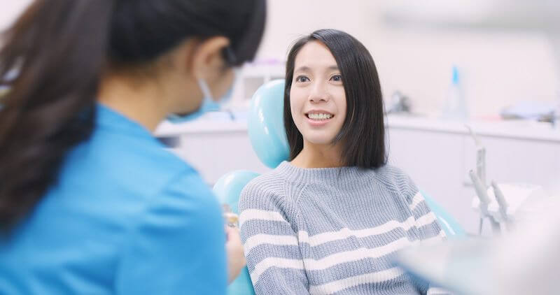 patient smiling at dentist
