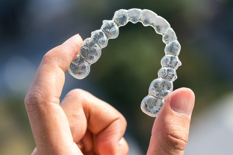 Girl smiling with invisalign