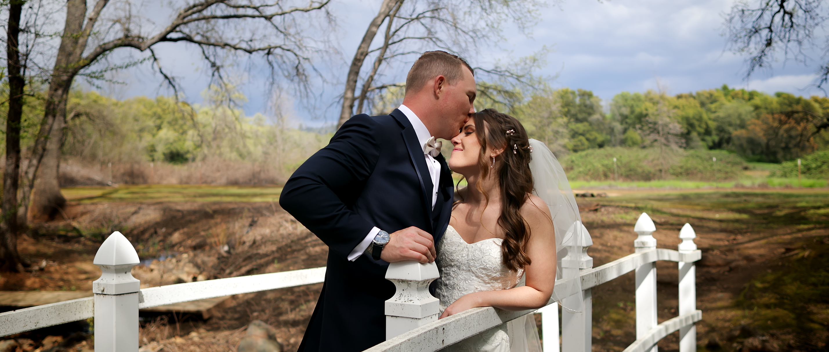 Groom kissing brides forehead from wedding filmed in Marysville, ca