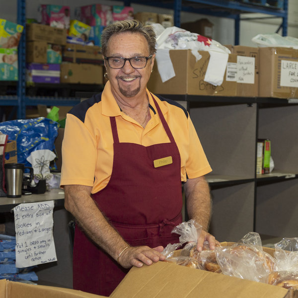 Man volunteering at food bank
