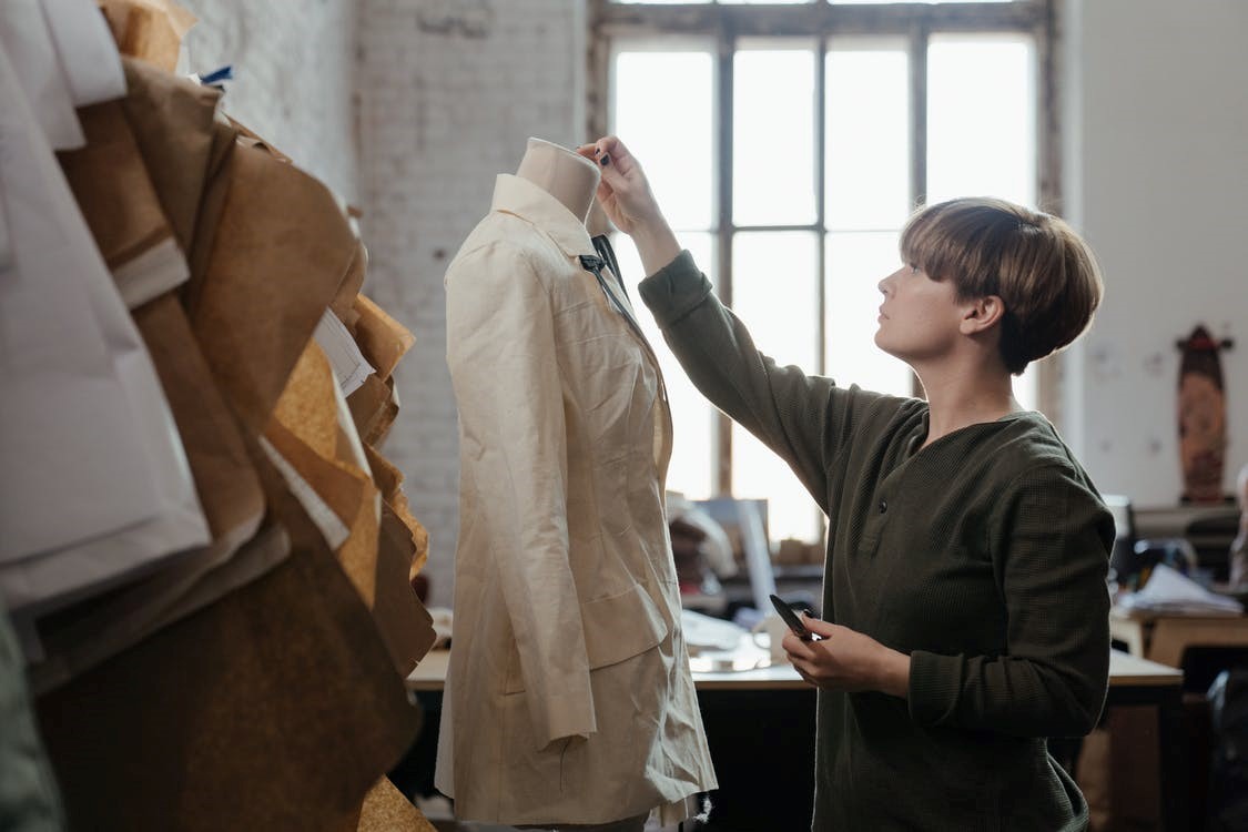 A garment manufacturer in her studio