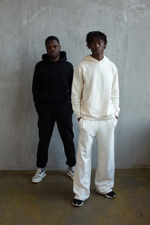 Two models wearing baggy clothing