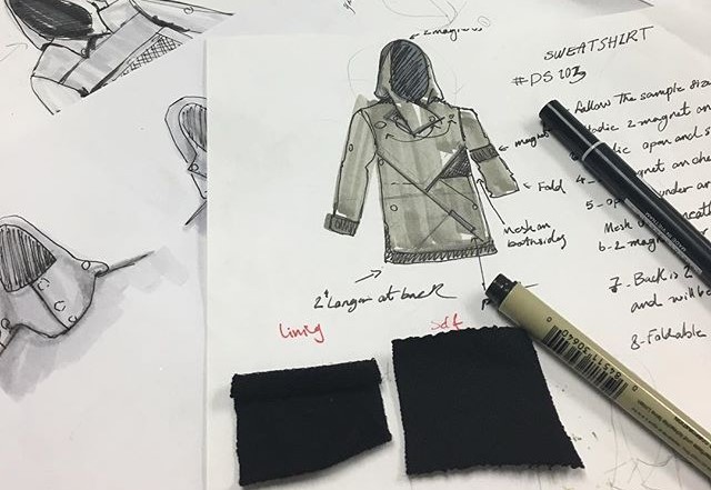 A designer making designs on a paper
