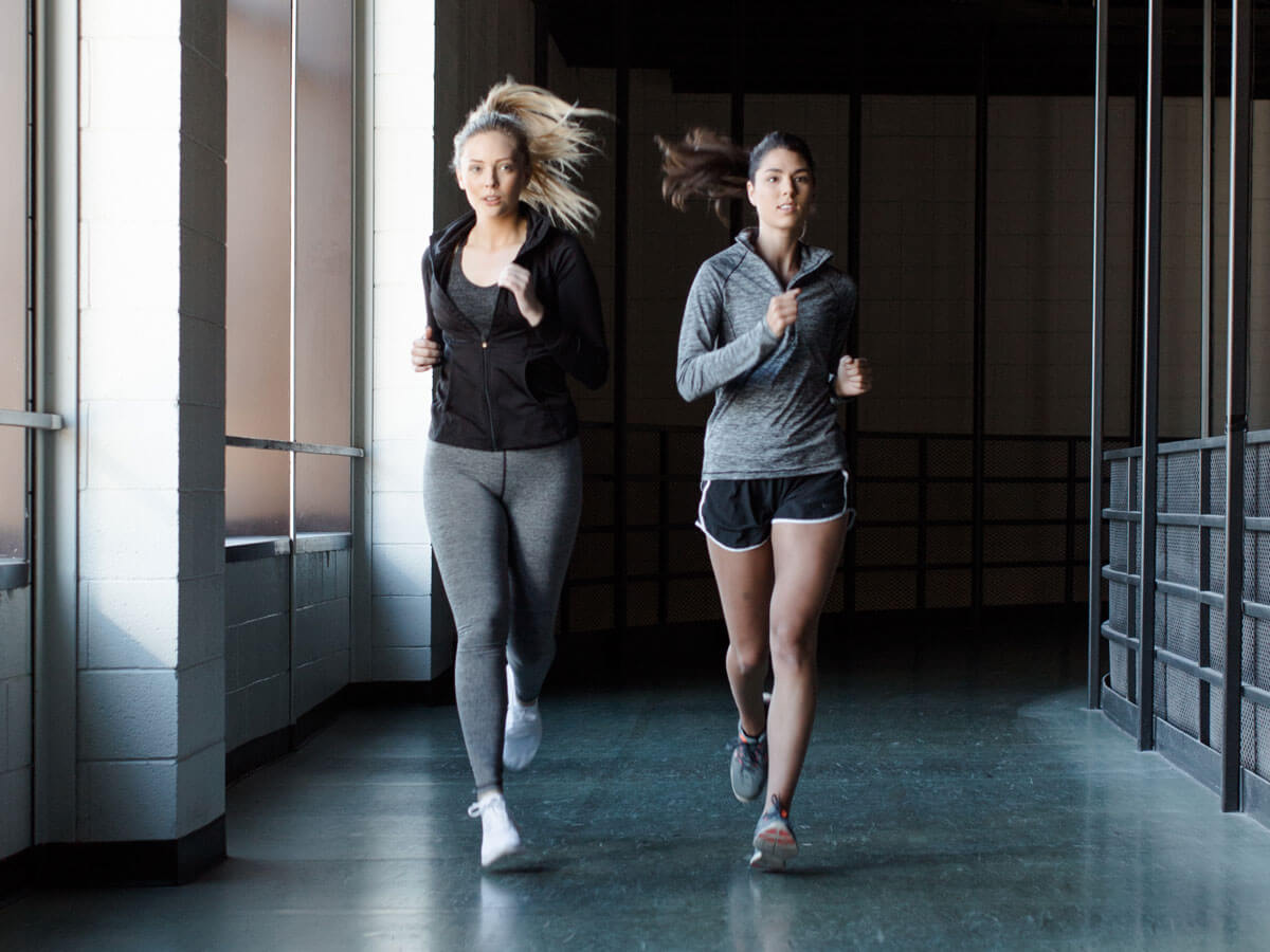 Two women running