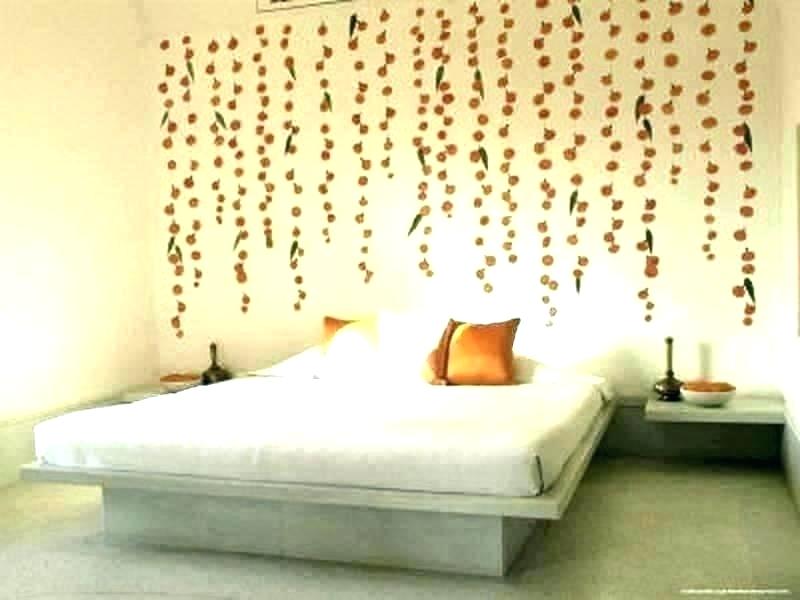 A dorm room decorated with rustic floral wall decals
