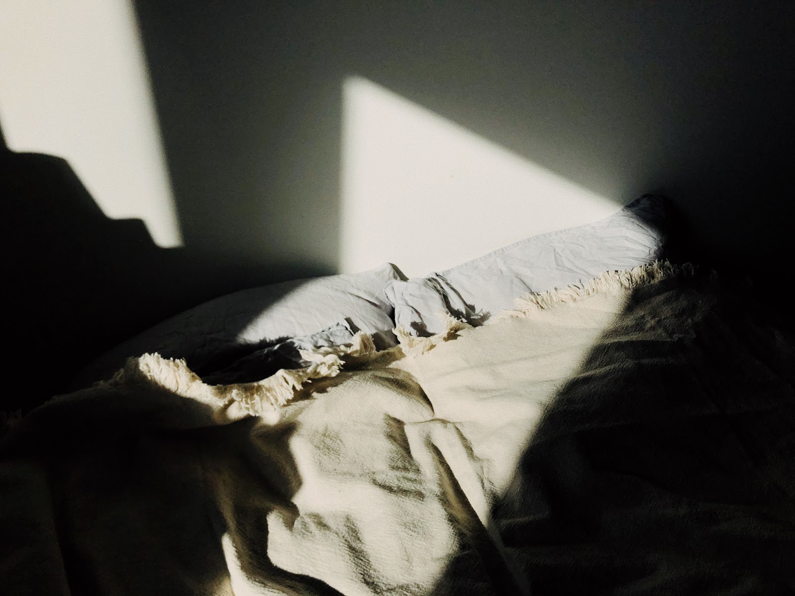 Blankets covered in shadows