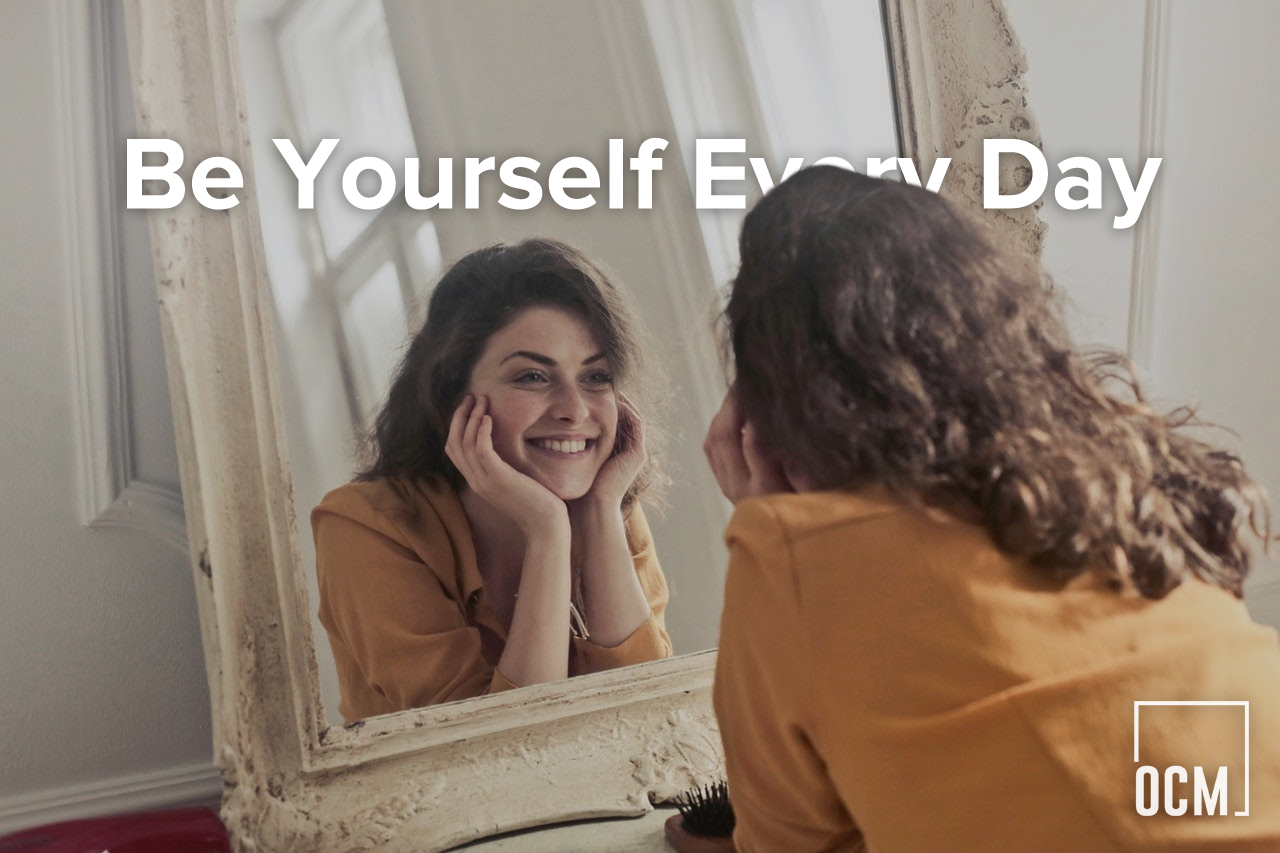 woman smilling in the mirror