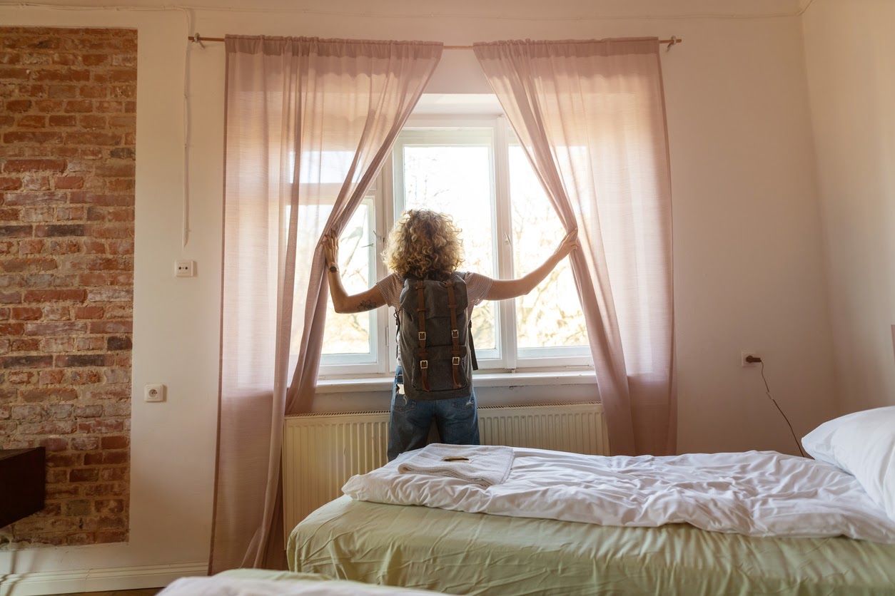 Woman standing near window