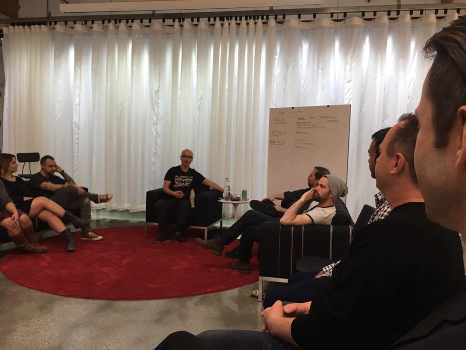 A professional sketching ideas on a whiteboard during the Futur Pro Business Design workshop.