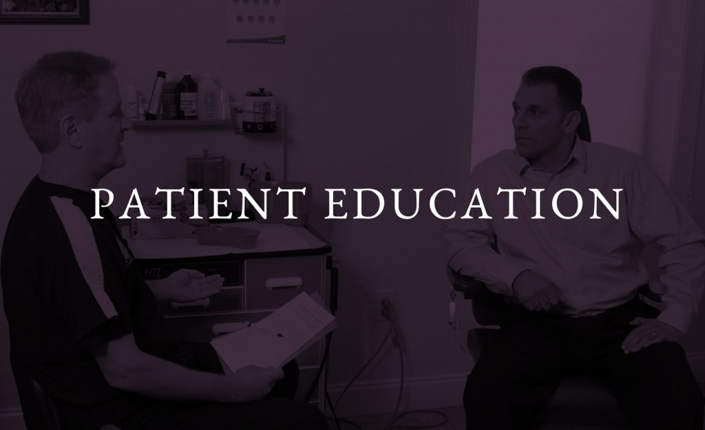 Dr Riesberg discussing his exam with a patient.