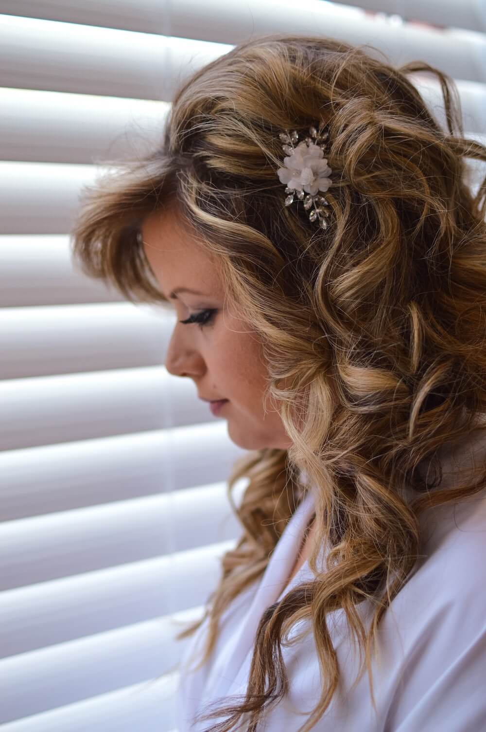 Woman in robe with wavy hair