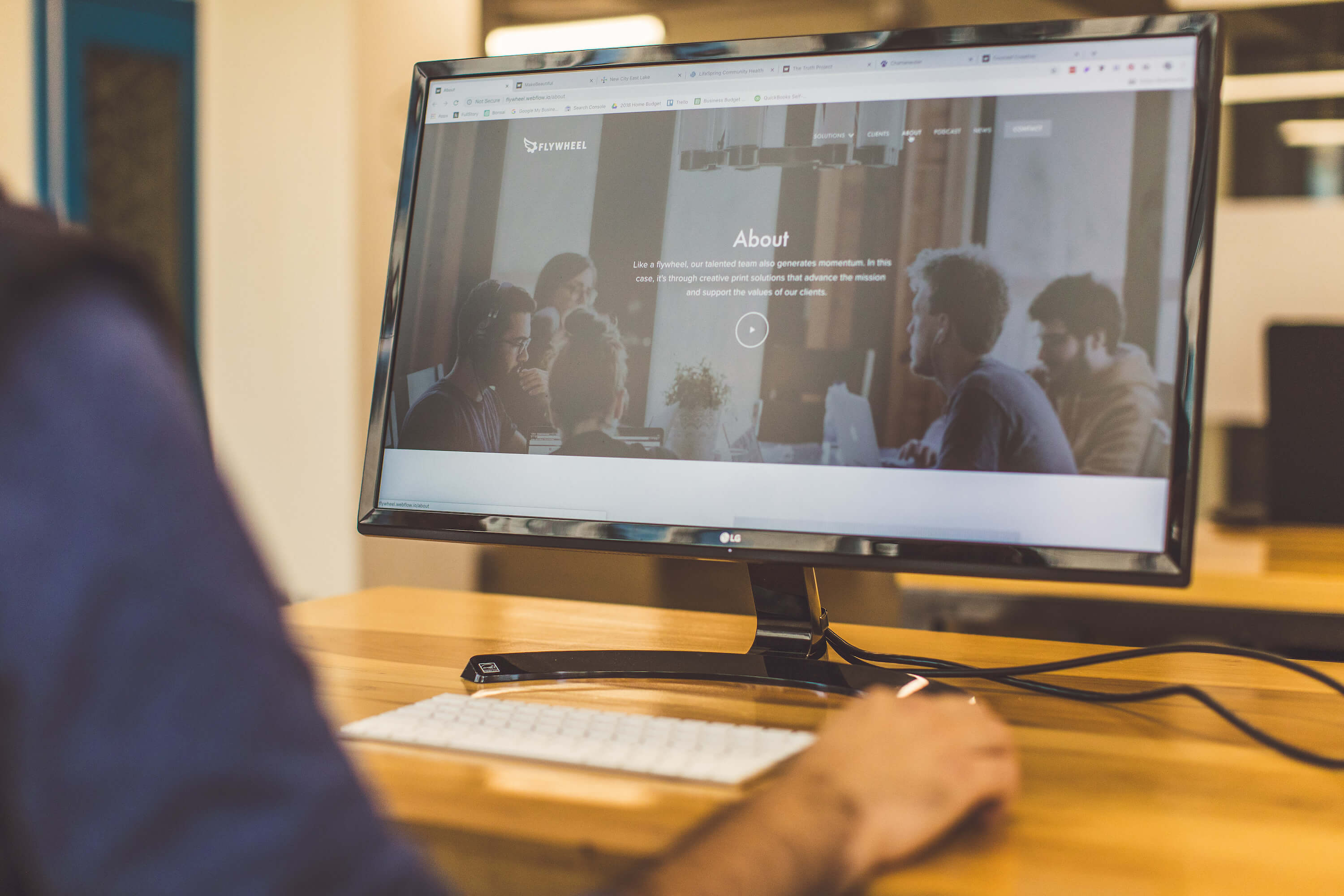 Medium shot of the Flywheel Brands About Page on a large monitor