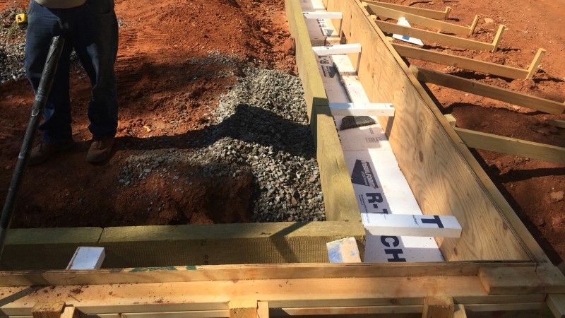 once that was really well compacted we dug our trenches for our the turn-down portion of our slabs