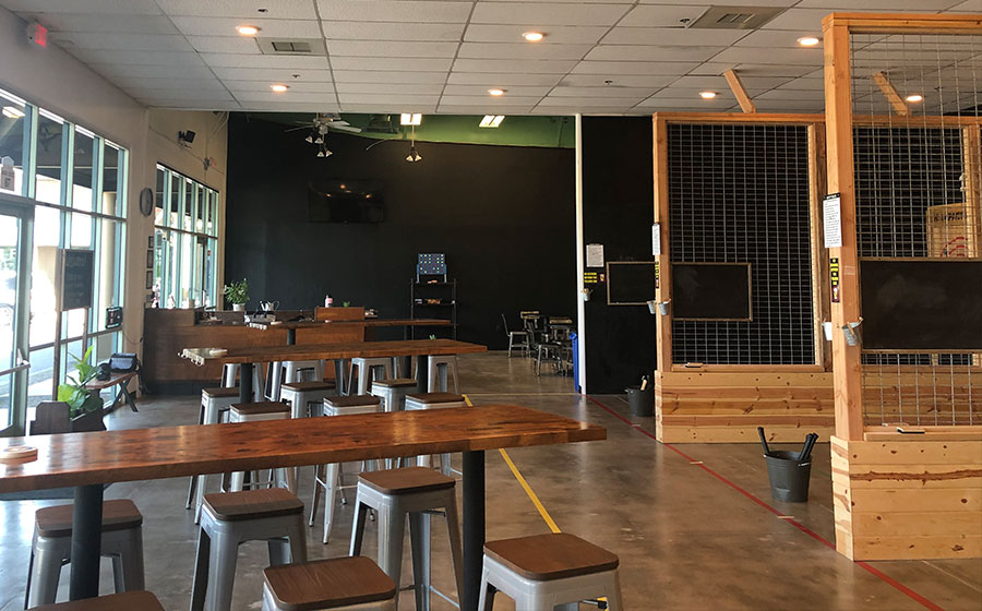 Interior of Impact Axe, with multiple lanes and tables.
