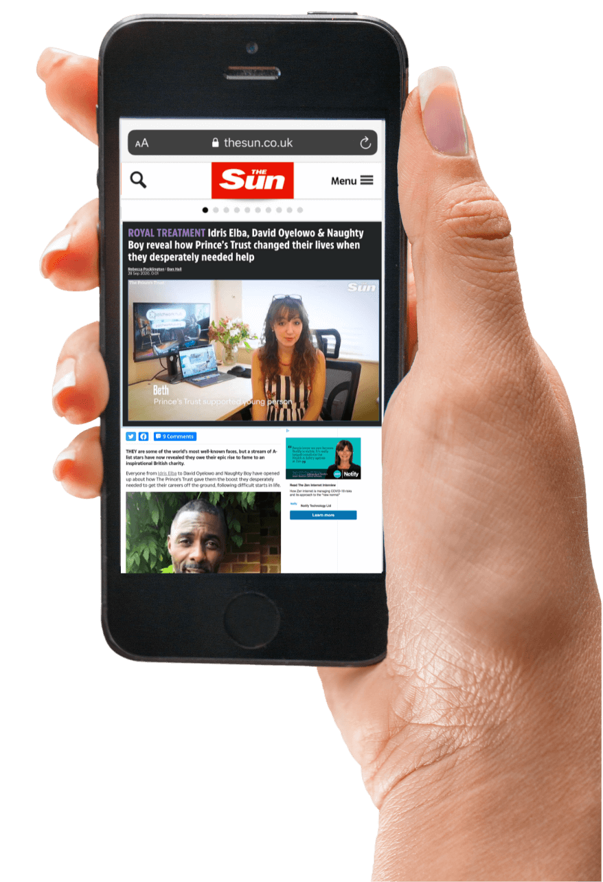 Hand holding mobile phone with Beth in The Sun newspaper on the screen.