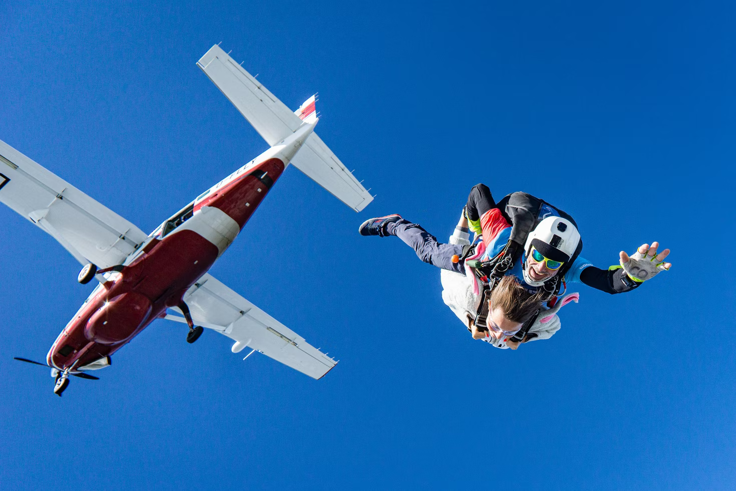 Two people skydiving. 