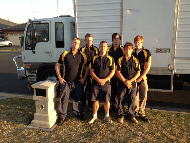 country capital removals team photo