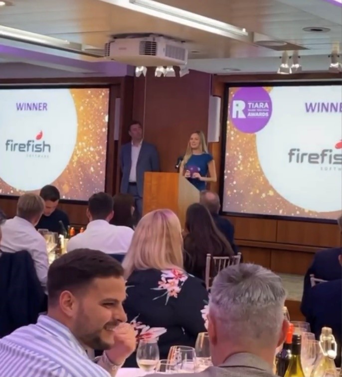 Firefish's Beth accepts the award