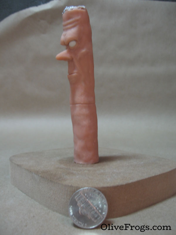 First miniature sculpture of a disgruntled cigarette creature.
