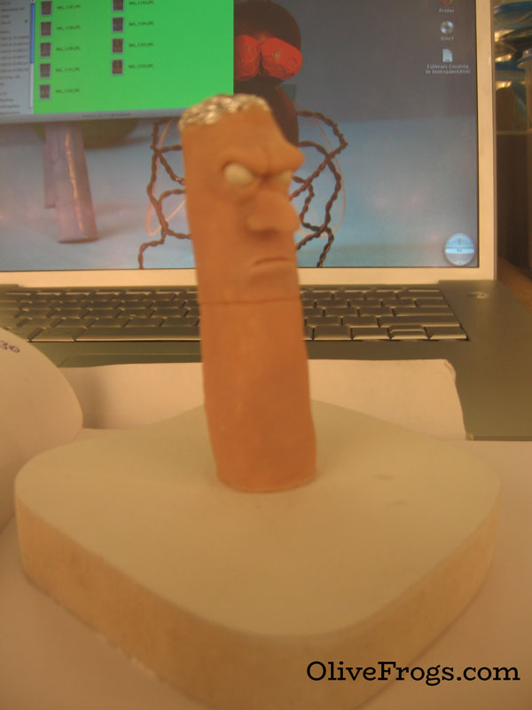 Second miniature sculpture of a disgruntled cigarette creature.