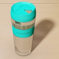 Double glass cup with turquoise lid.