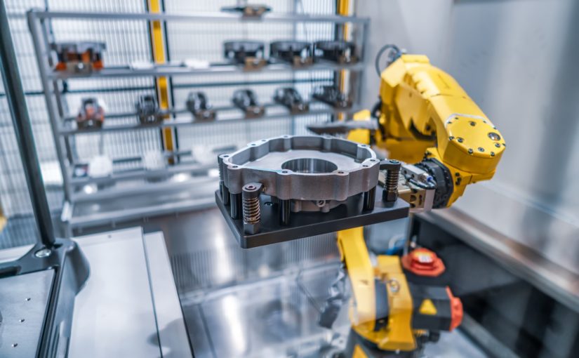 Manufacturing robot holding a casting part