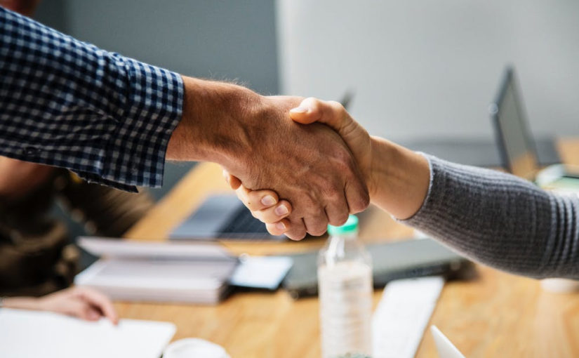 Two people shaking hands.