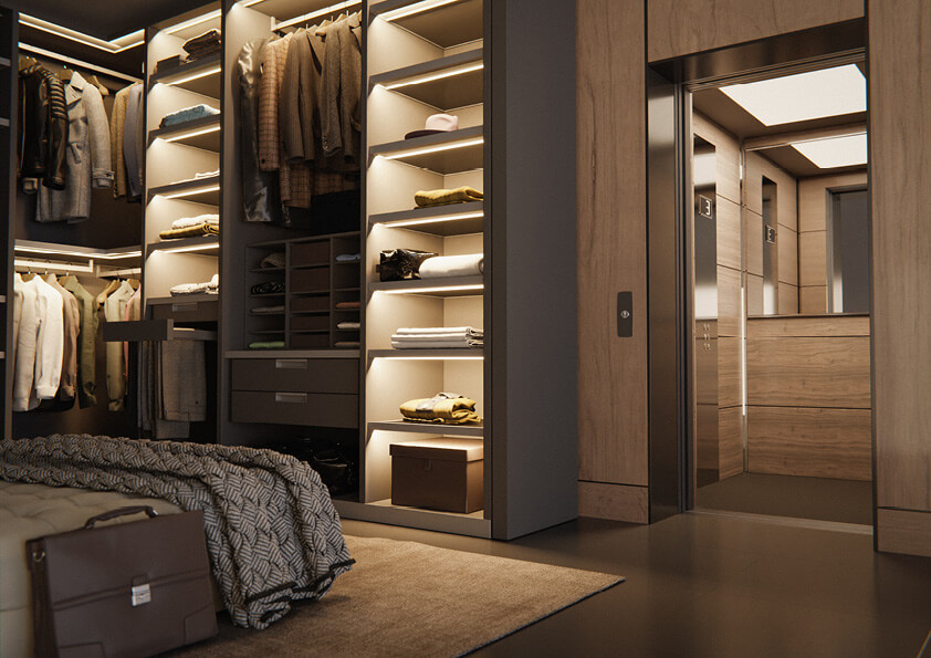 Home lift with wood panels for a mid-century look opening to a walk in wardrobe.