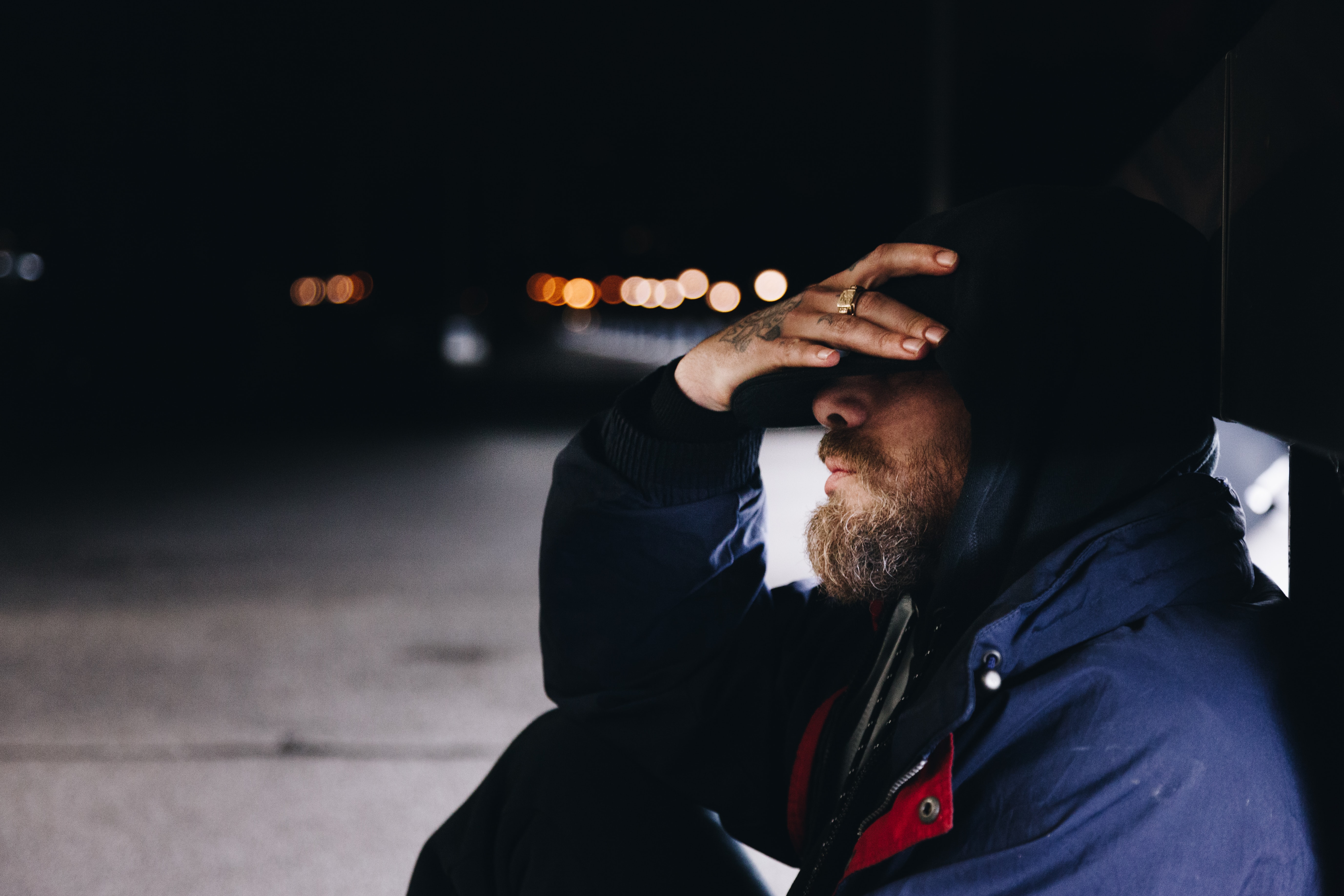 bearded man with hand on head feeling stuck in life