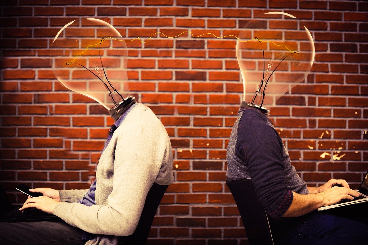 2 productive workers in open-plan office