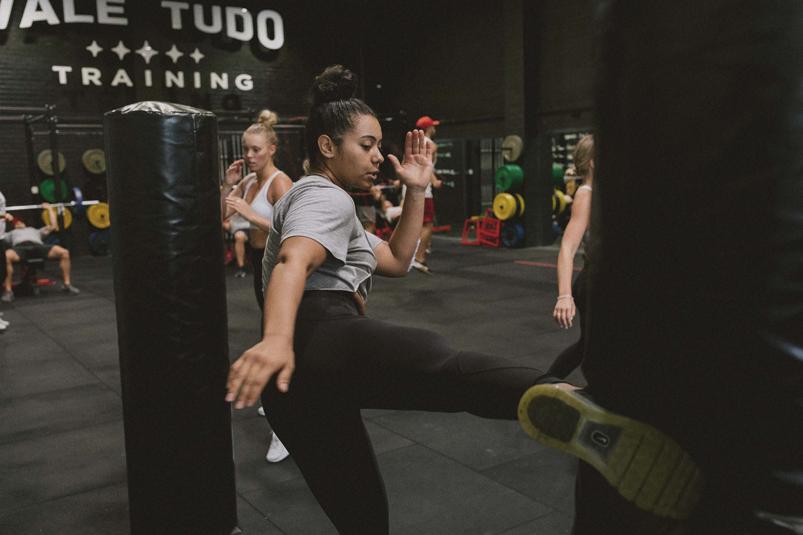 female athlete training kickboxing and mixed martial arts
