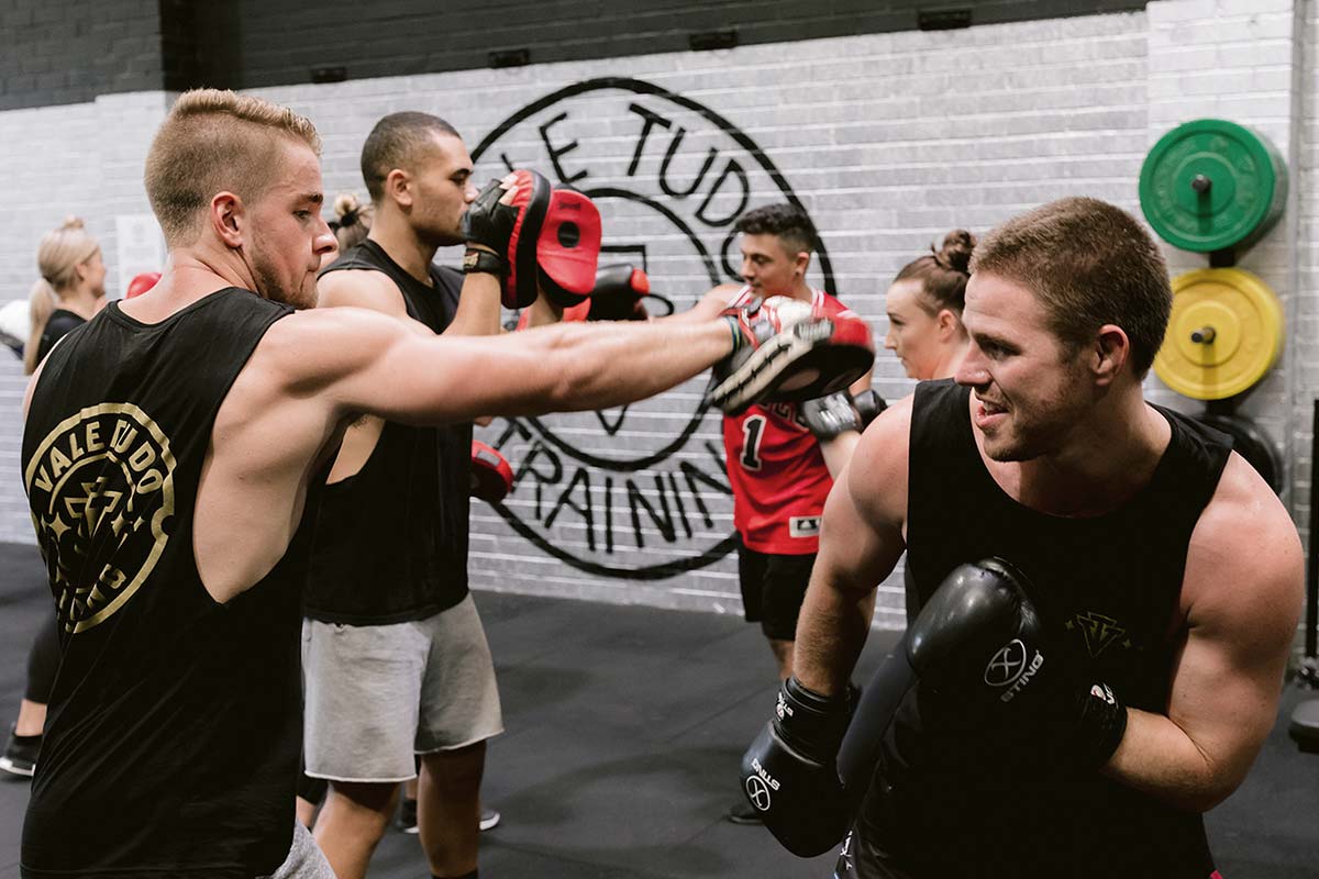 male athletes sparring in boxing training exercise