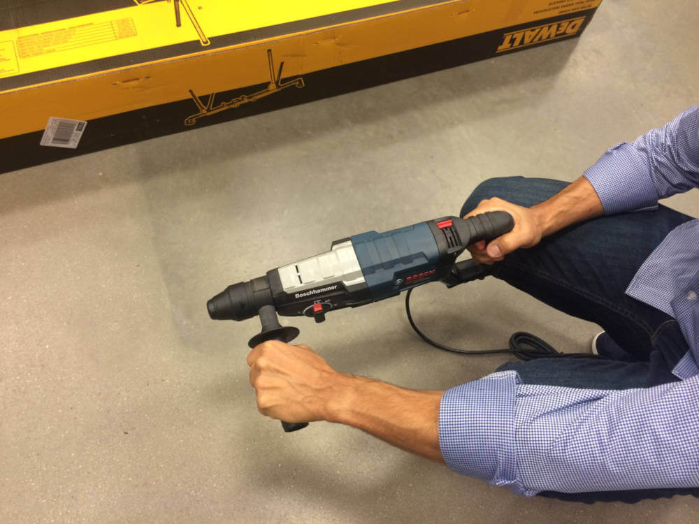 warehouse worker holding a drill