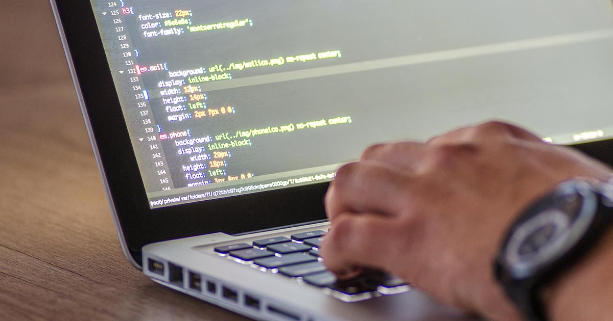 coding on laptop