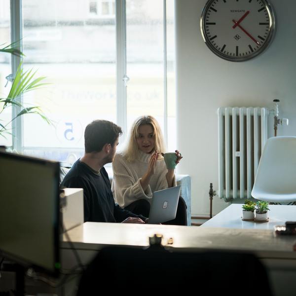 2 people talking over coffee