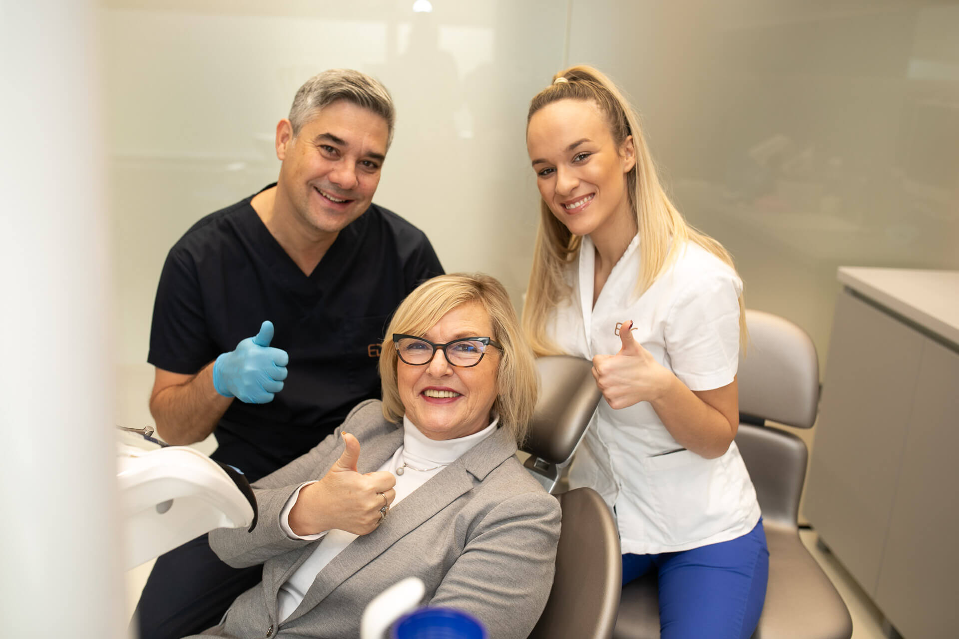 Doctor and patient smiling after the procedure