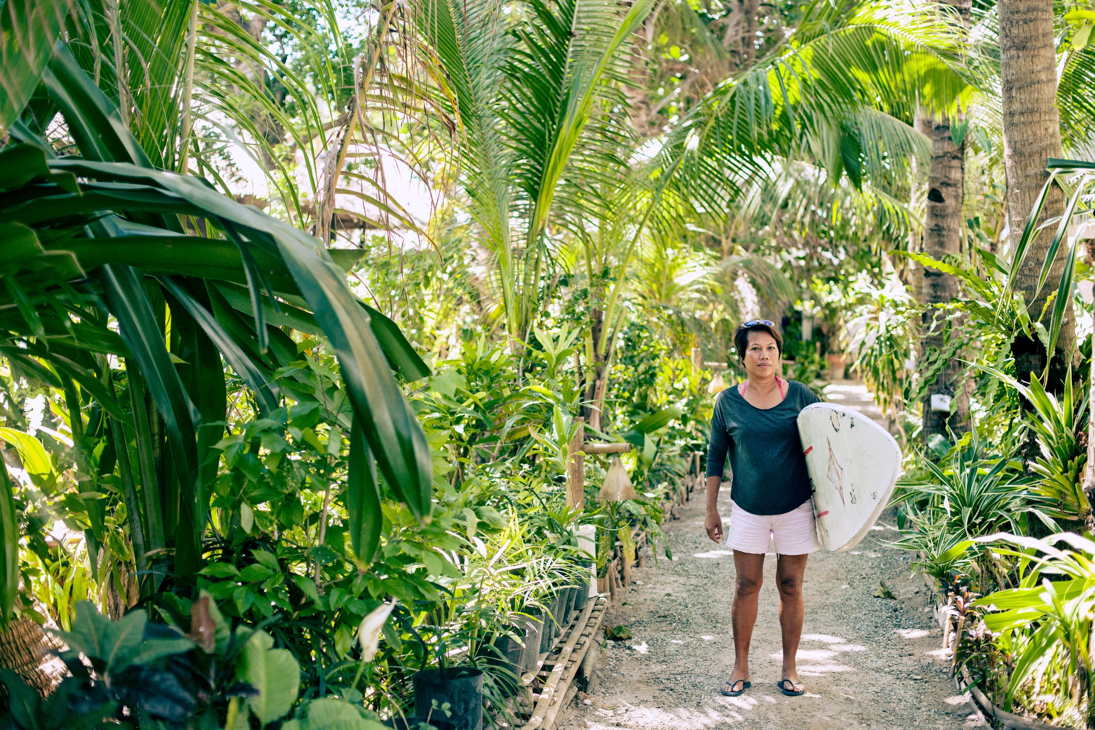 Photo of Nenette Graf with a surfboard