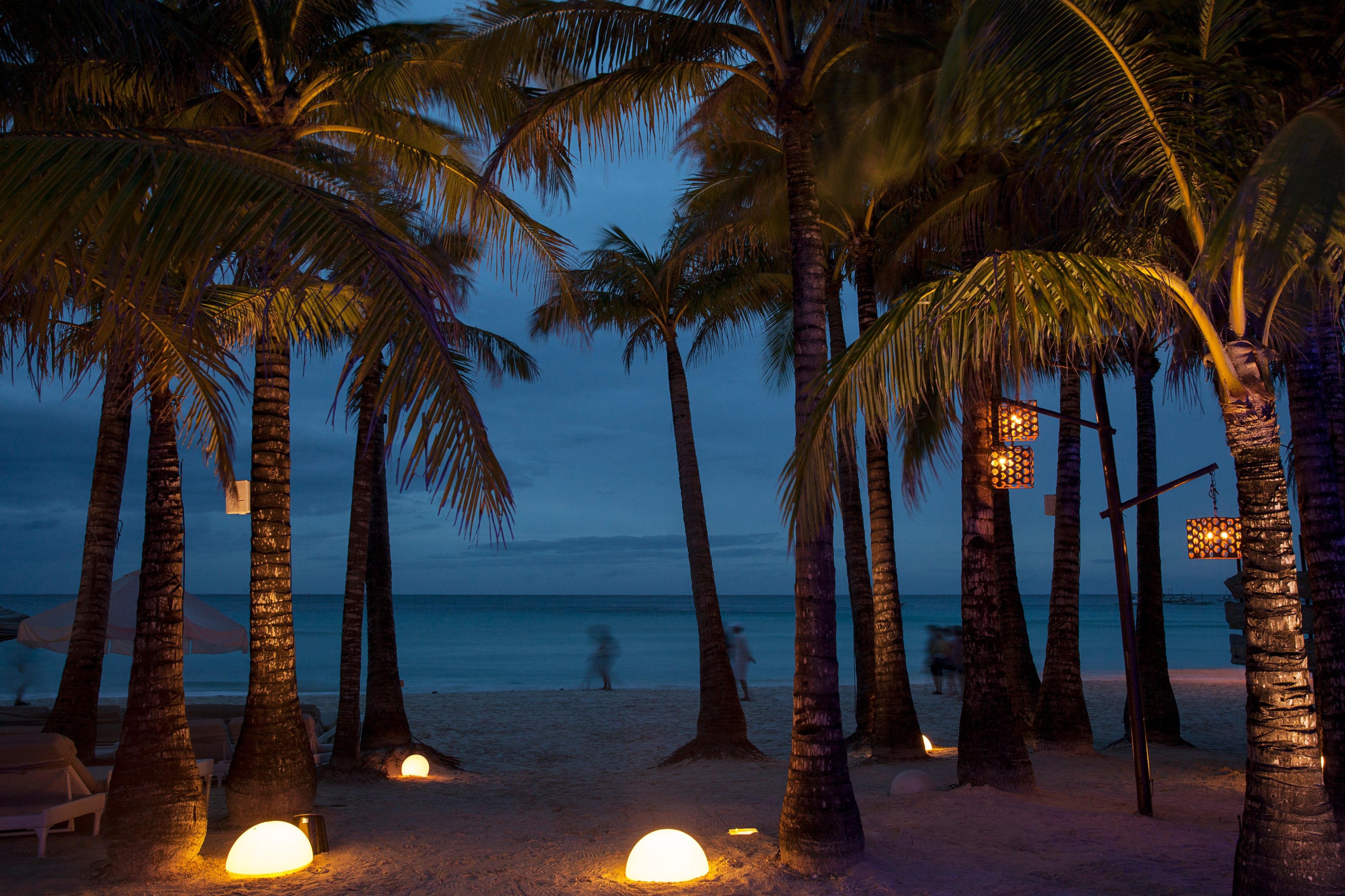 Landscape photo of the Boracay beachfront with floor lights at night