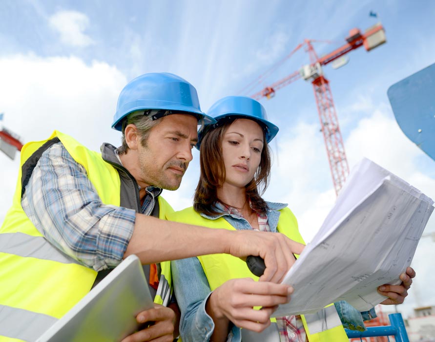 construction contractors reviewing bid details