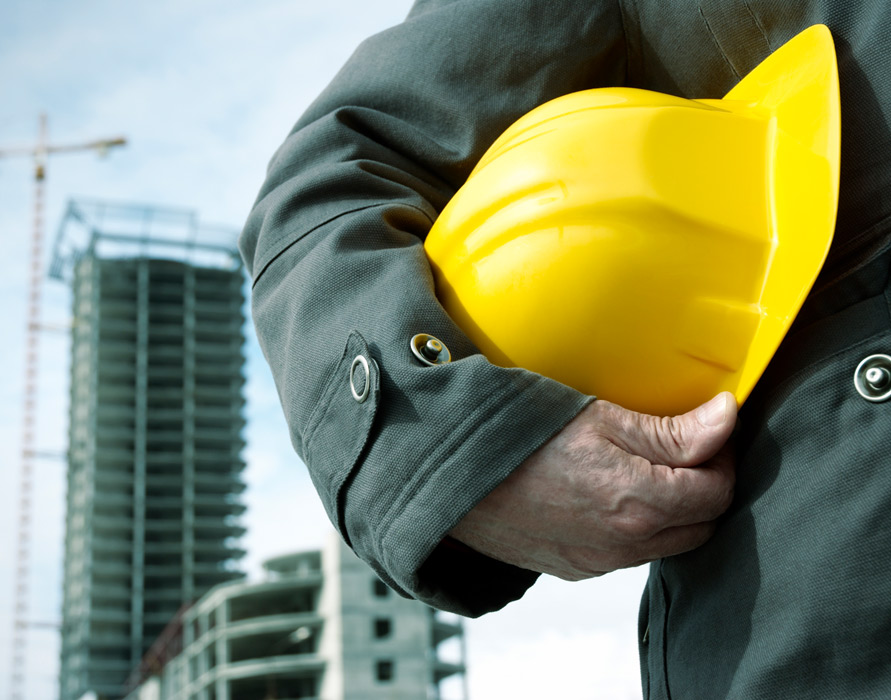 contractor looking at building
