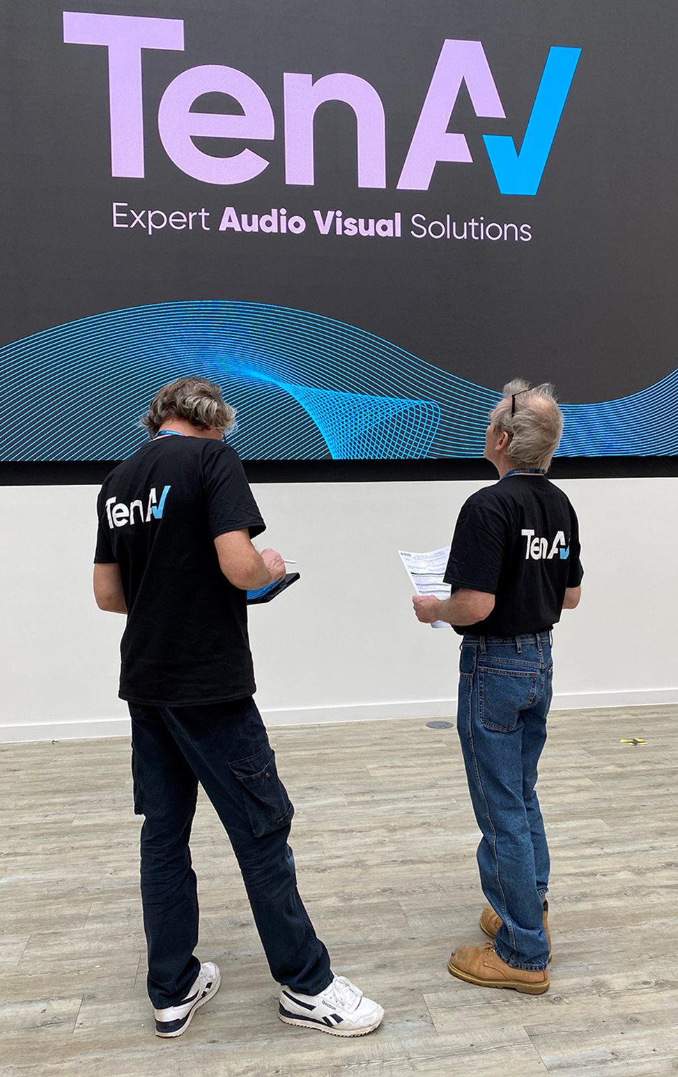 Image of our engineers on site at Amadeus Heathrow, installing a 6m x 4m video wall from LED panels.