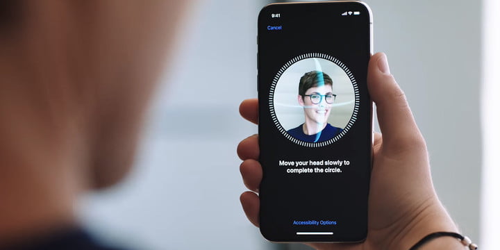 An iPhone user scanning their face in order to use Apple’s Face ID.