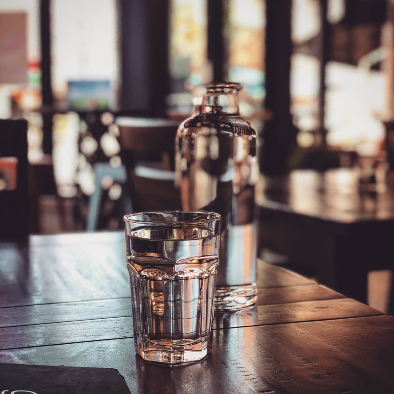 Glass of water on wood table