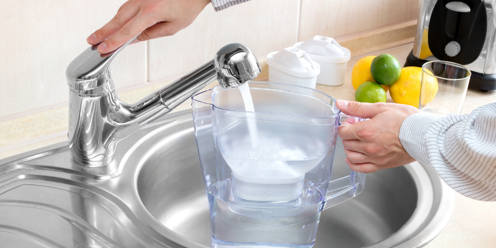 A Photo Of A Person Getting Tap Water