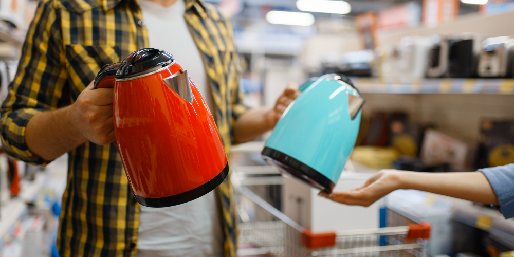 A Photo Of A Man Choosing The Best Tea Kettle To Buy