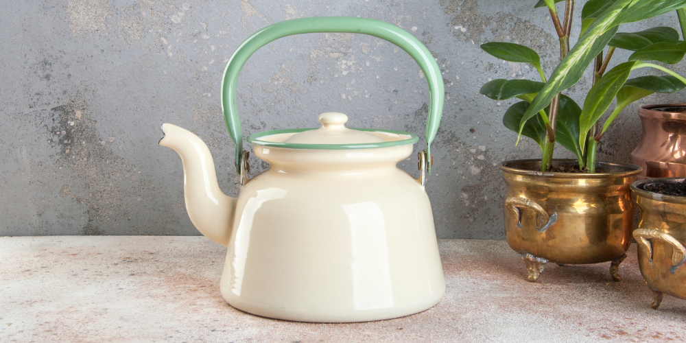 A Photo Of A White Enamel Tea Kettle