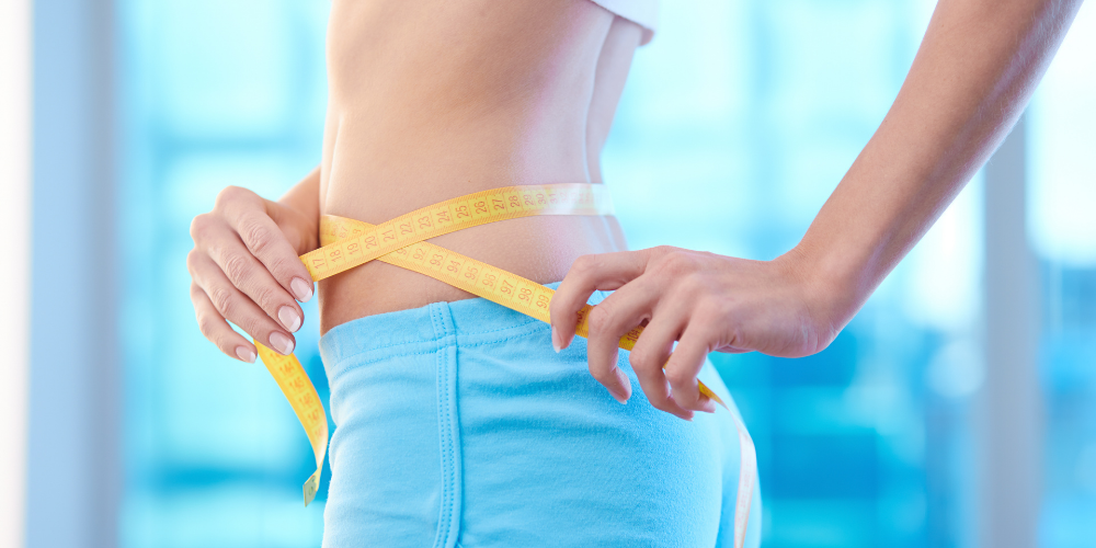 A Photo Of A Woman Measuring Her Waist